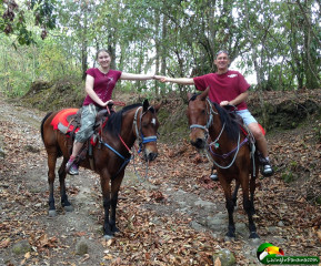 Father and daughter ride trails near Volcan Panama