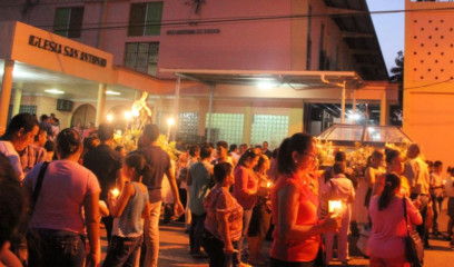 People begin the procession with lighted candles in hand