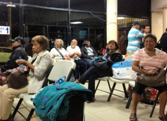 People waiting at the bus station in David, Panama