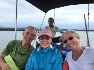 Reyn, his mom, and sister in a water taxi in Bocas.  His mom swore by her light-weight wind breaker!