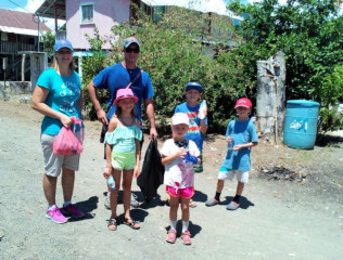 An expat family getting ready to help with beach clean up
