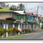 2 story wooden buildings along asphalt road