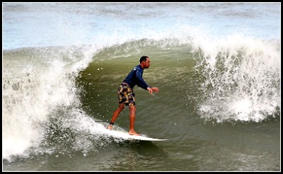 close up of a surfer in a curl