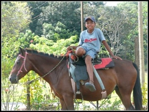 boy dismounting a horse