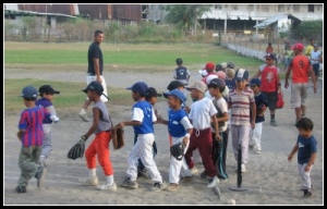 Kids doing high-fives after a baseball game in Puerto Armuelles