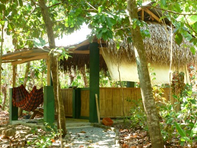 open air sleeping hut with hammock