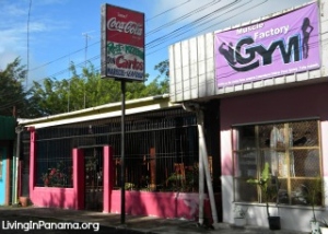 Street front of pink restaurant and Gym