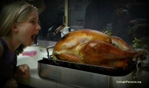 Little Girl Pretending to Eat A Whole Turkey In One Bite