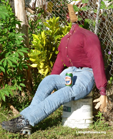 A stuffed effigy against a chain link fence for a new year celebration.