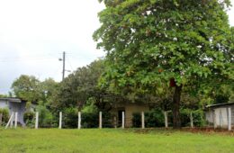 Photo of beach front lot with white fence posts