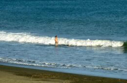 Photo of middle aged man standing in the surf