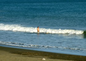 Photo of middle aged man standing in the surf