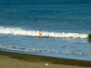 Photo of middle aged man standing in the surf