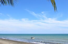 photo of small fishing boat on ocean