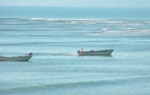 2small fishing boats on blue ocean