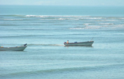 2small fishing boats on blue ocean