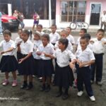 10 young school kids singing