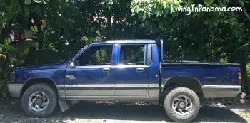 Blue Mitsubishi L-200 truck parked in our yard