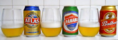 Glass and can of 3 beers: Atlas, Panama, Balboa