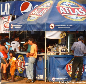 People buying beer at Atlas tent at fair in David Panama