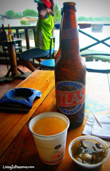 Bottle of Atlas beer, ceviche, on a bar on the water