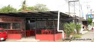 open air restaurant with red facade