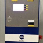 Blue, silver, and white ticket machine