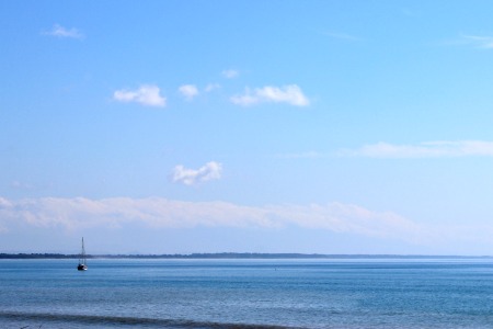 ocean with sail boat on water