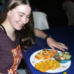 Girl showing off dinner at seafood resturant in Puerto Armuelles Panama