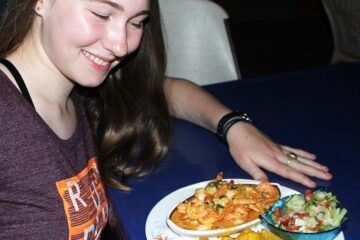 Girl showing off dinner at seafood resturant in Puerto Armuelles Panama