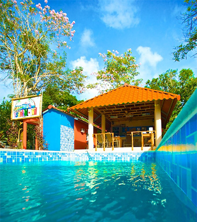 swimming pool and gazebo at Tsunami Inn