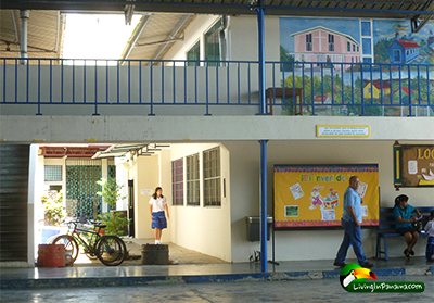 teacher and student walking in different parts of the school grounds