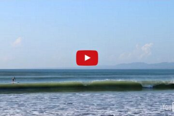 man paddle boarding on the ocean