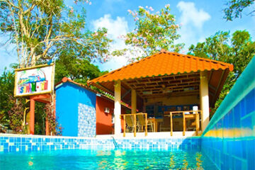 swimming pool and gazebo at Tsunami Inn