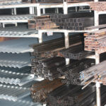 shelves of zinc roofing, rebar, and other metal building supplies