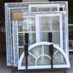 Windows, in white plastic frames, in a rack