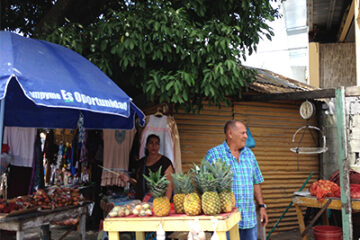 Man standing at his produce stand in Puerto armuelles panama