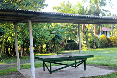 ping pong table outside and under a roof