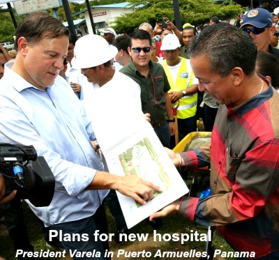 Pres. Varela showing drawings of new hospital to new and audience