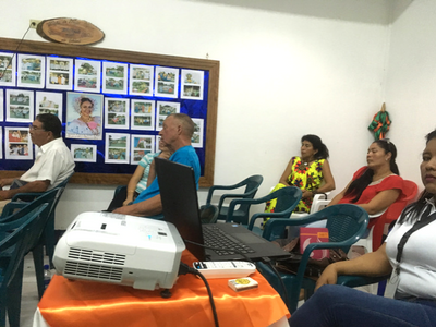 Photo of people sitting in a presentation meeting