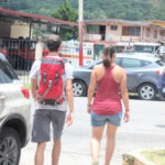 A young couple walking, seen from back