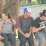 people sitting on bench under tree in David, Panama