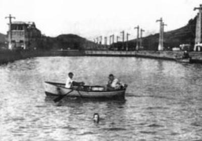 historic photo of halliburton swimming Panama Canal