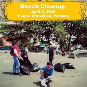 people on beach with bags of trash