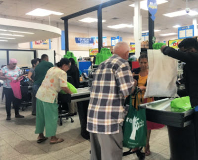 3 grocery checkout with people using reusable bags brought from home